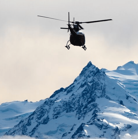 Helicopter flying over mountains